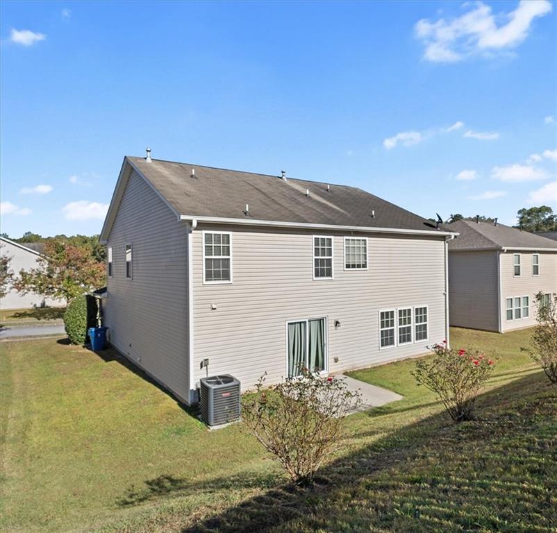 2068 White Top Road Southeast Lawrenceville, GA 30045 - Photo 40 of 41 a view of a house with a yard
