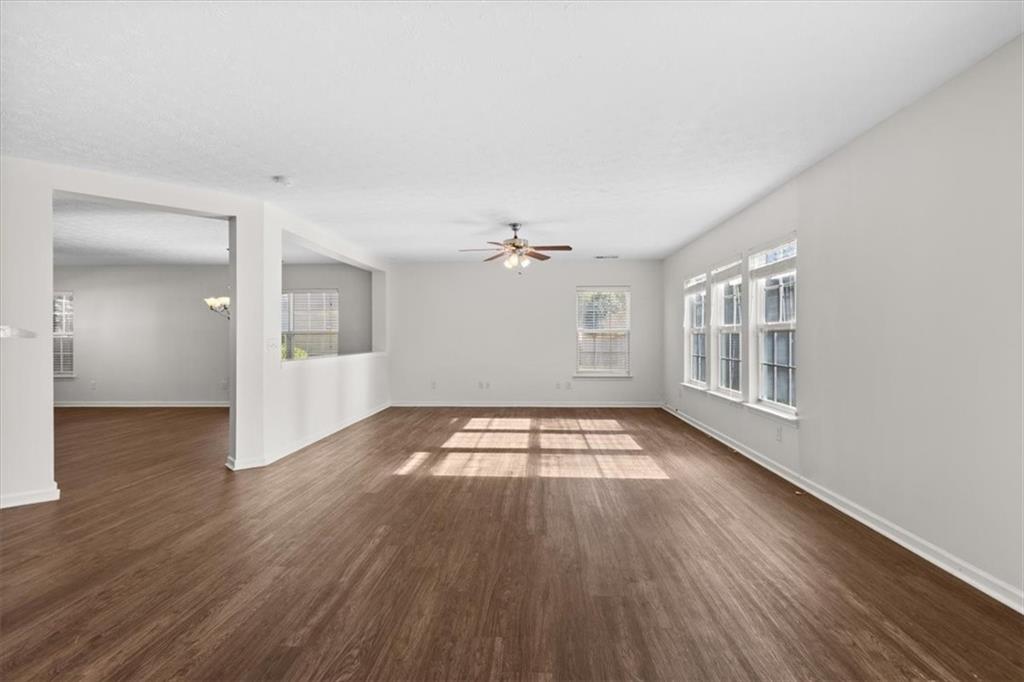 2068 White Top Road Southeast Lawrenceville, GA 30045 - Photo 9 of 41 a view of livingroom with hardwood floor and window