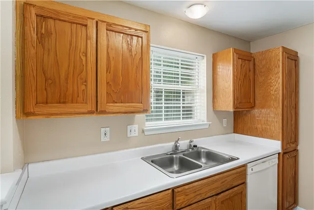 a kitchen with a sink and a window