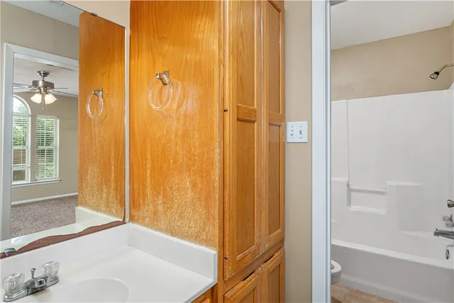 a bathroom with a bathtub and shower