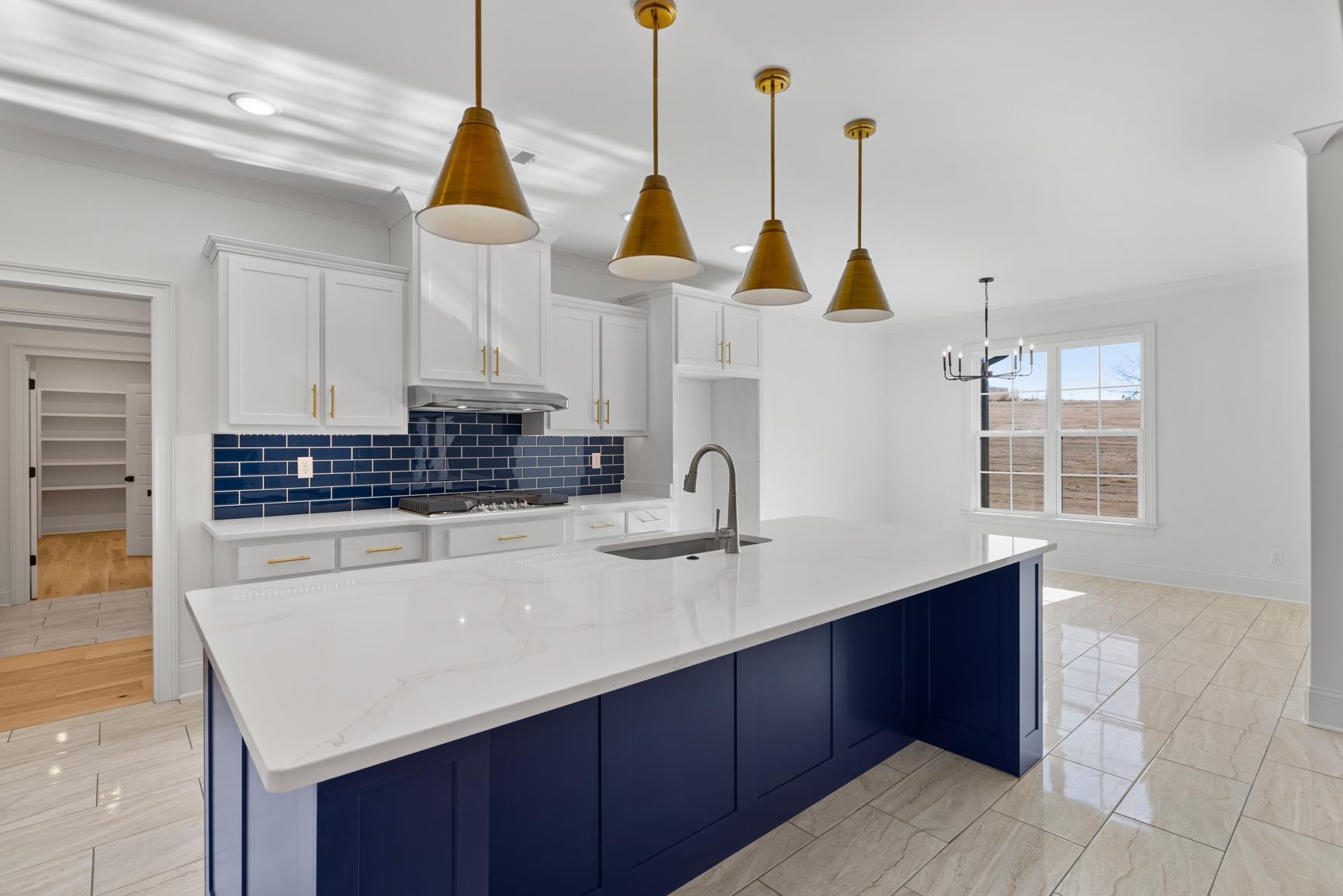 822 Leta Loop Brighton, TN 38011 - Photo 11 of 40 a kitchen with kitchen island granite countertop a sink a counter space and cabinets