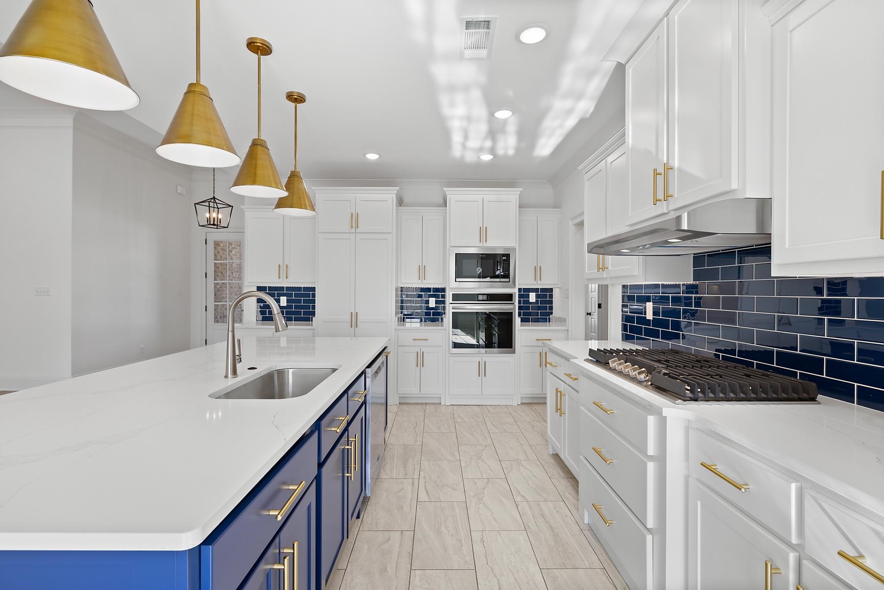 822 Leta Loop Brighton, TN 38011 - Photo 13 of 40 a kitchen with stainless steel appliances granite countertop a sink a stove and a wooden floors