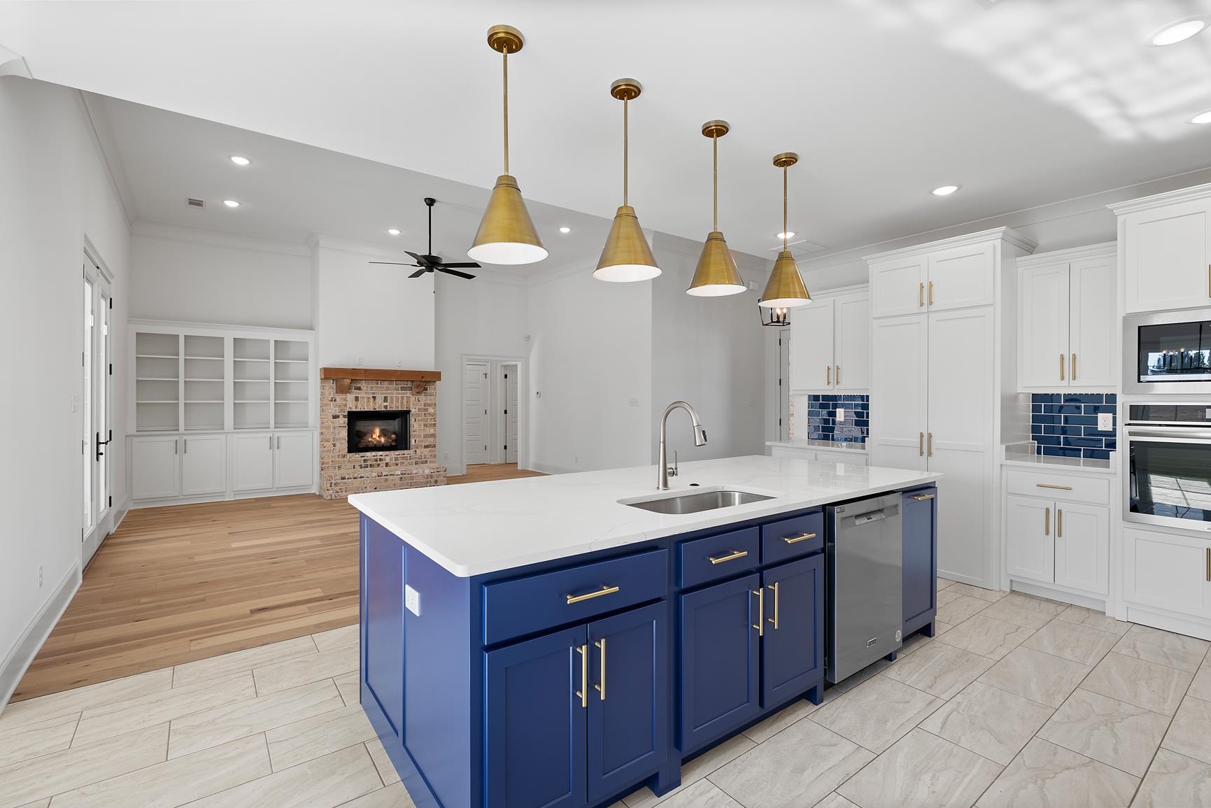 822 Leta Loop Brighton, TN 38011 - Photo 14 of 40 a kitchen with kitchen island a sink appliances and a counter top space