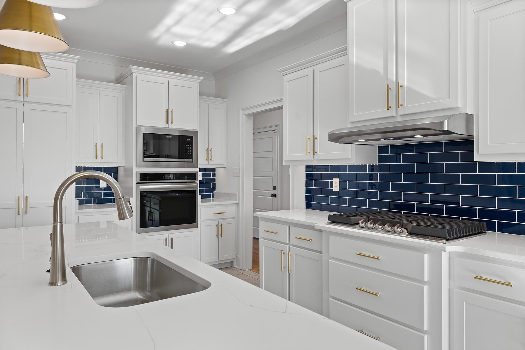 822 Leta Loop Brighton, TN 38011 - Photo 15 of 40 a kitchen with granite countertop a sink stainless steel appliances and cabinets