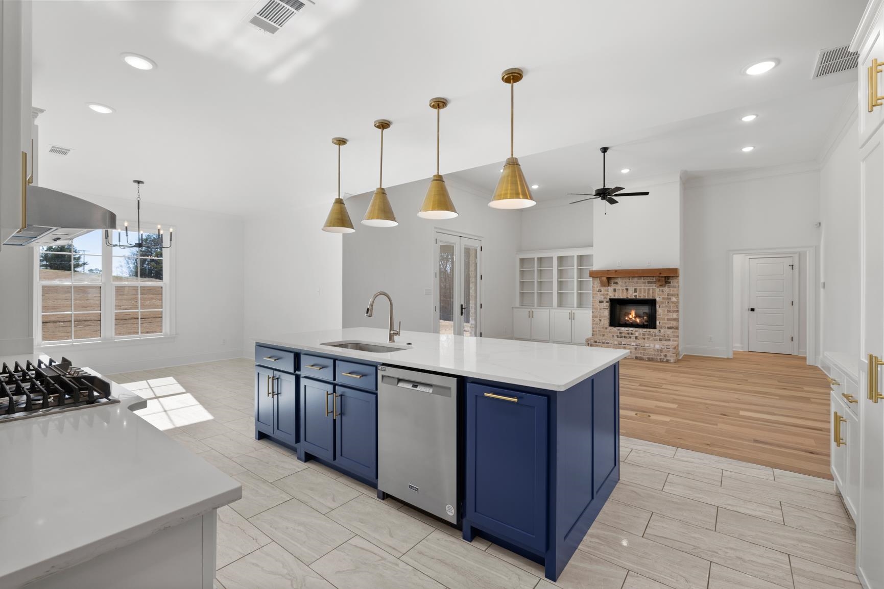 822 Leta Loop Brighton, TN 38011 - Photo 16 of 40 a kitchen with stainless steel appliances kitchen island granite countertop a sink and a stove