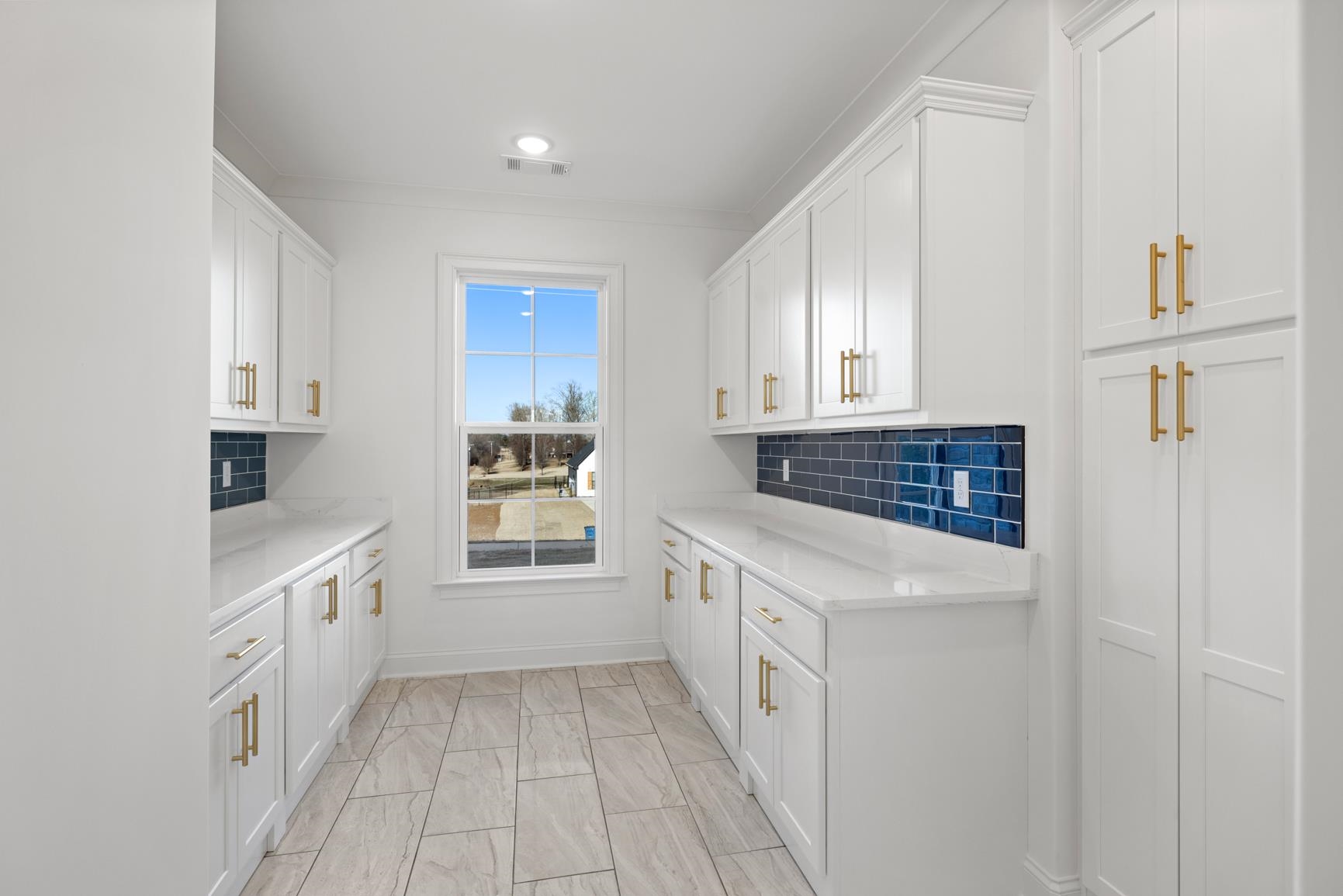 822 Leta Loop Brighton, TN 38011 - Photo 19 of 40 a kitchen with granite countertop white cabinets and white appliances
