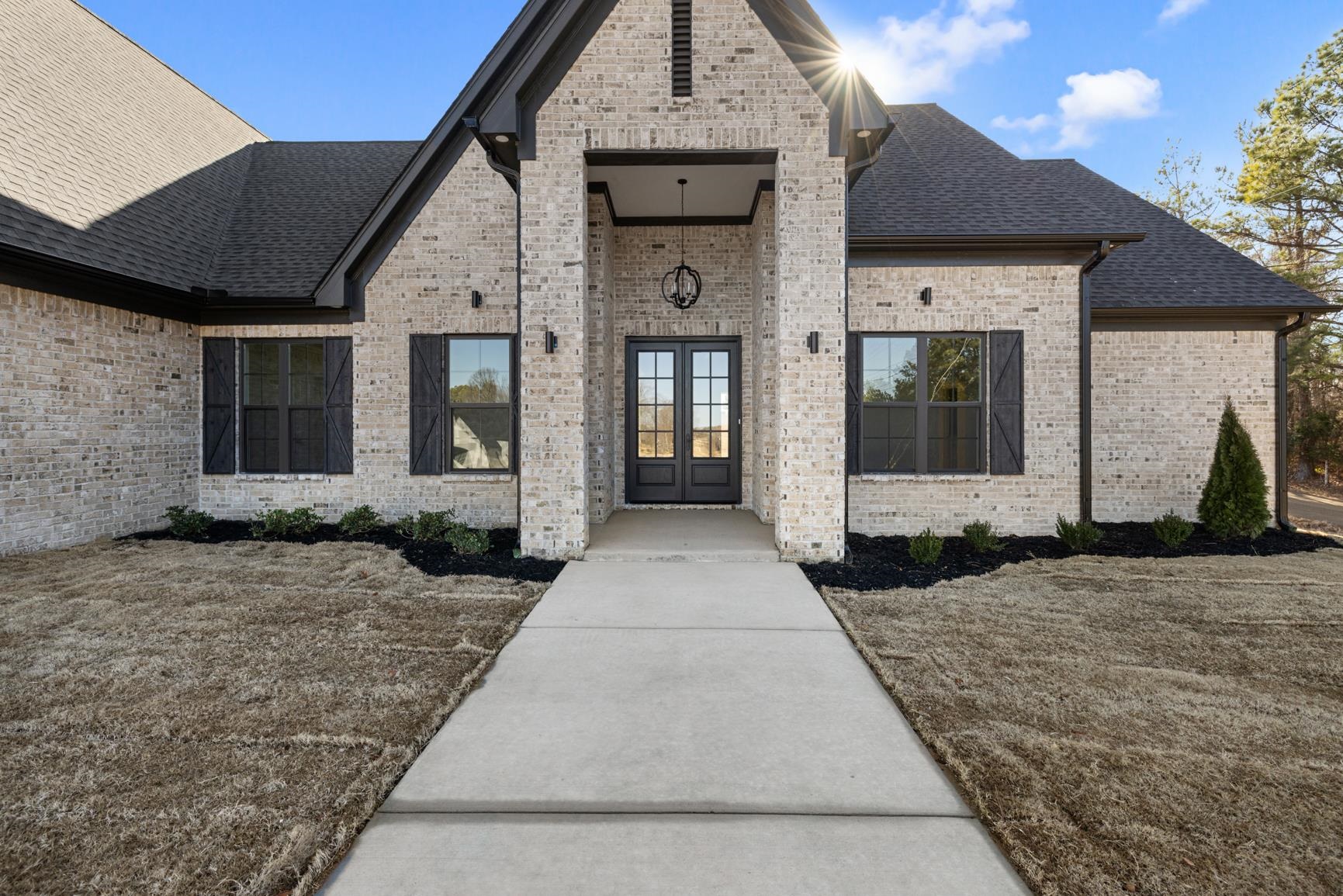 822 Leta Loop Brighton, TN 38011 - Photo 2 of 40 a front view of a house with a garden
