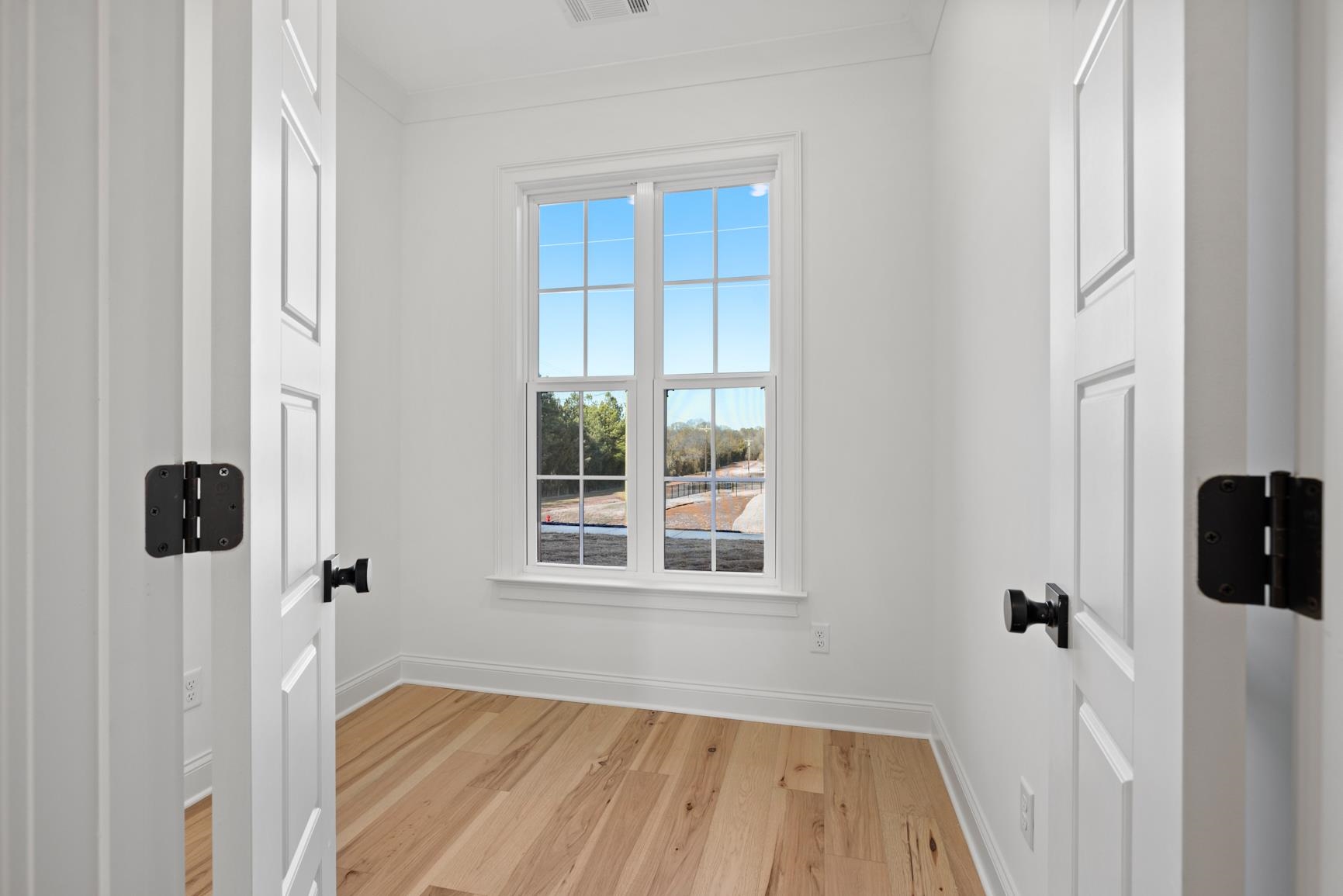 822 Leta Loop Brighton, TN 38011 - Photo 22 of 40 a view of a hallway with wooden floor and front door