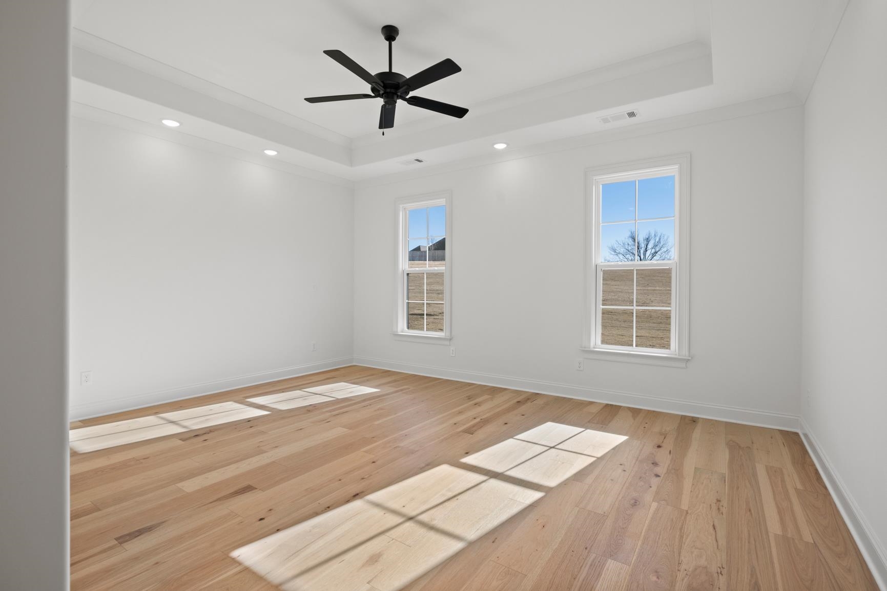 822 Leta Loop Brighton, TN 38011 - Photo 24 of 40 an empty room with wooden floor and windows