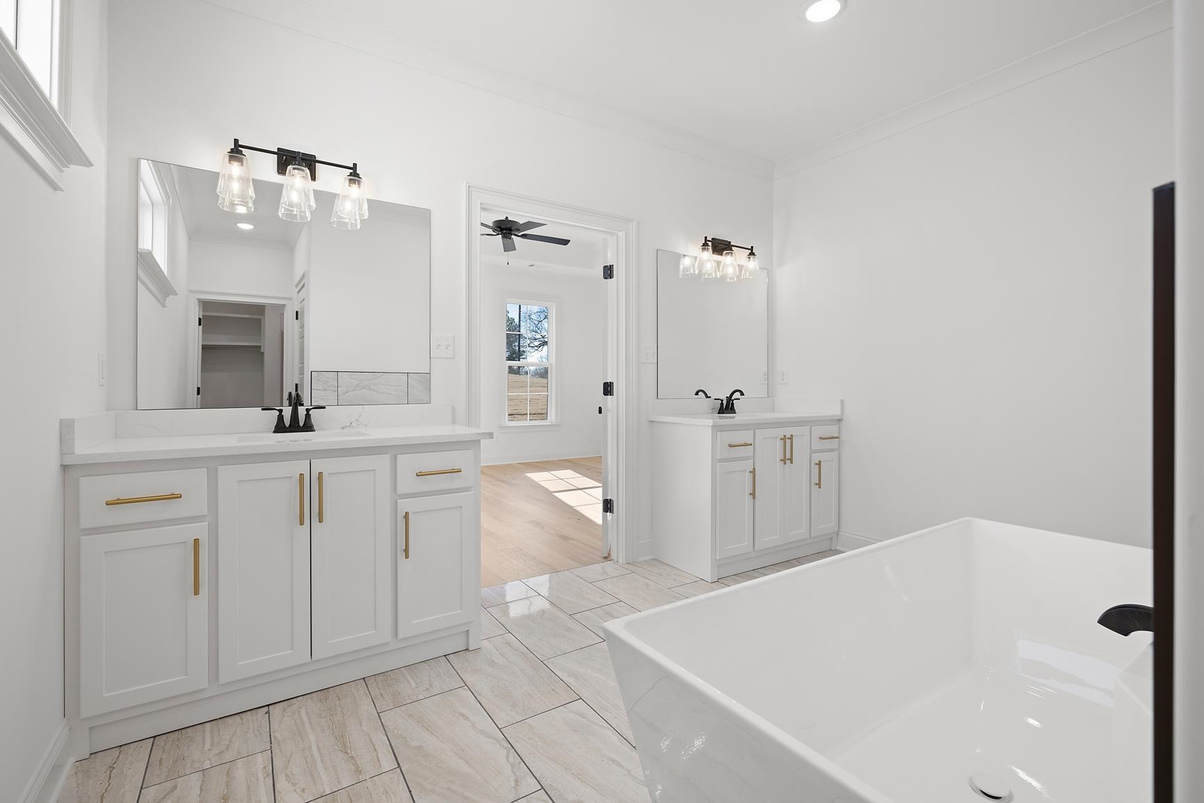 822 Leta Loop Brighton, TN 38011 - Photo 29 of 40 a spacious bathroom with a double vanity sink mirror and