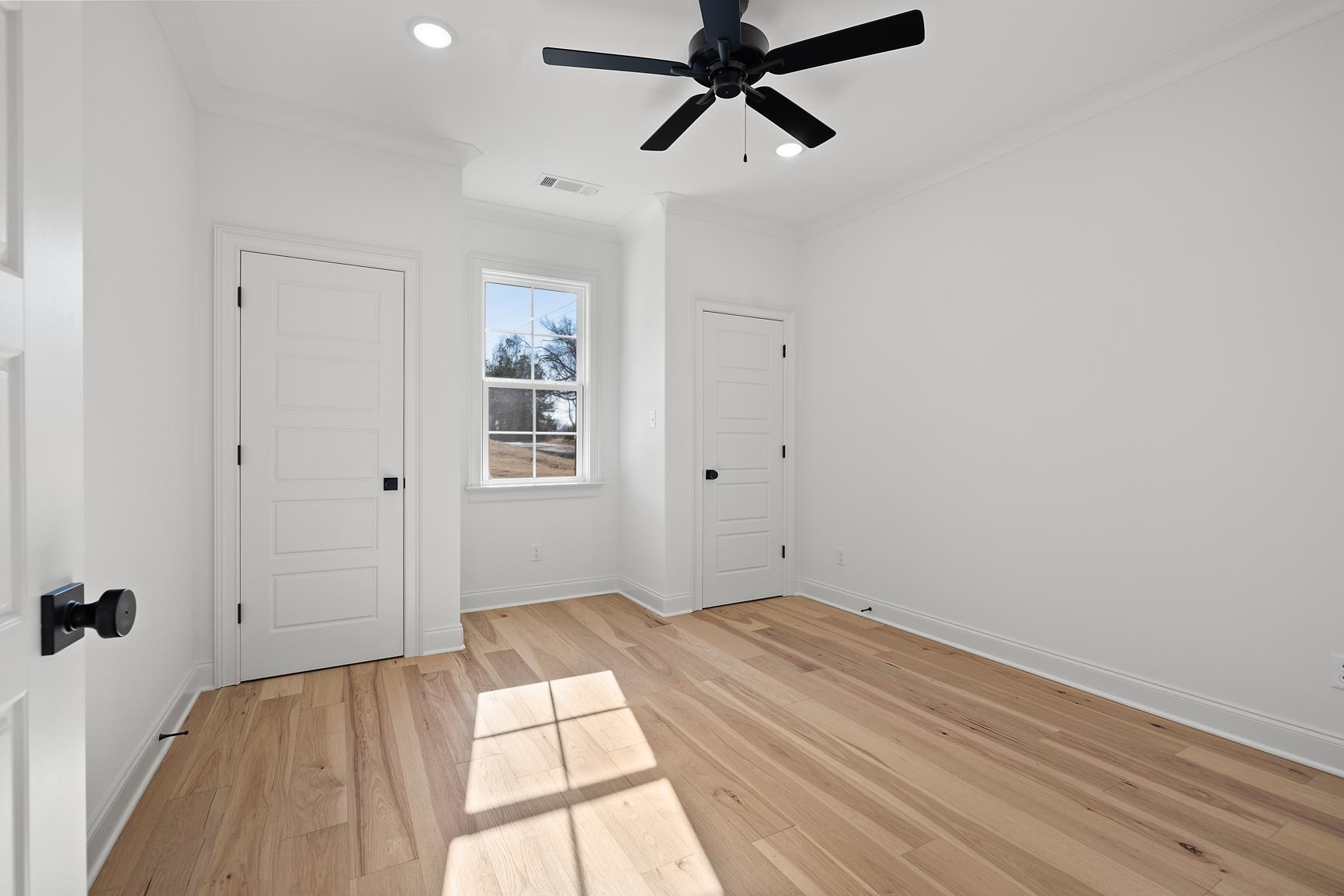 822 Leta Loop Brighton, TN 38011 - Photo 33 of 40 a view of a room with wooden floor and white walls
