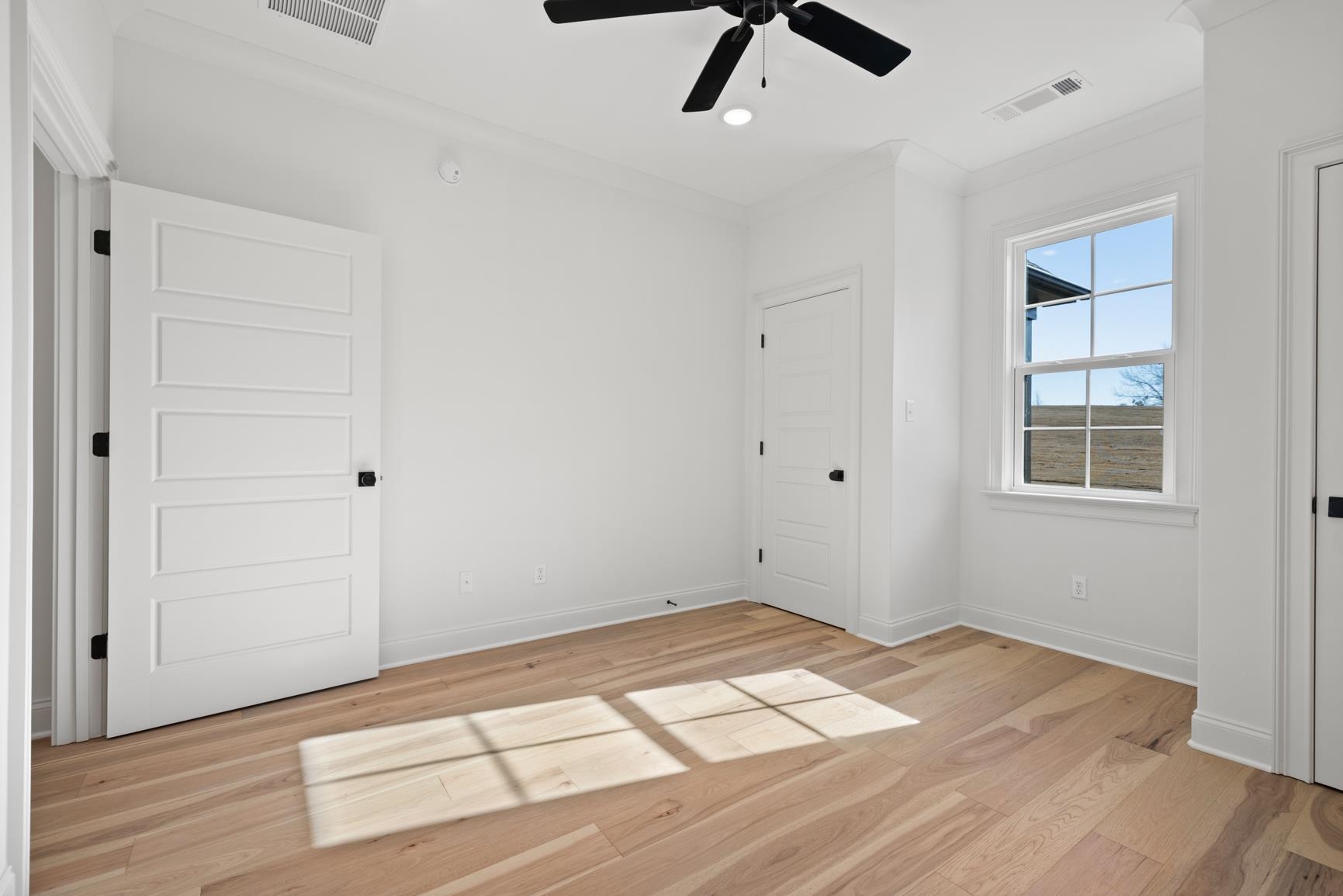 822 Leta Loop Brighton, TN 38011 - Photo 34 of 40 a view of a room with wooden floor and white walls
