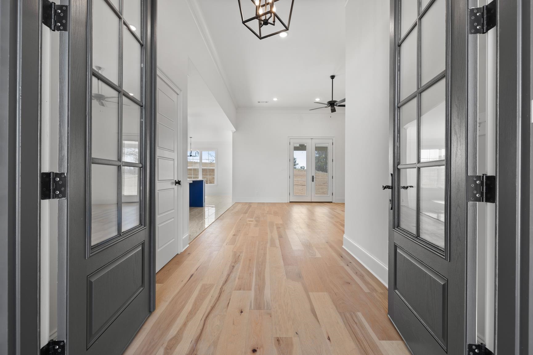 822 Leta Loop Brighton, TN 38011 - Photo 4 of 40 a view of hallway with wooden floor and a chandelier