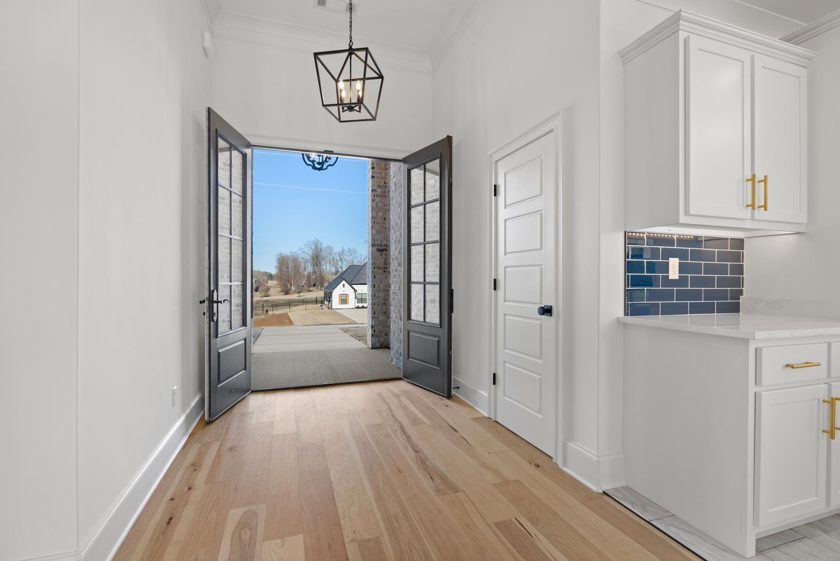 822 Leta Loop Brighton, TN 38011 - Photo 5 of 40 a view of a hallway with wooden floor and dining room