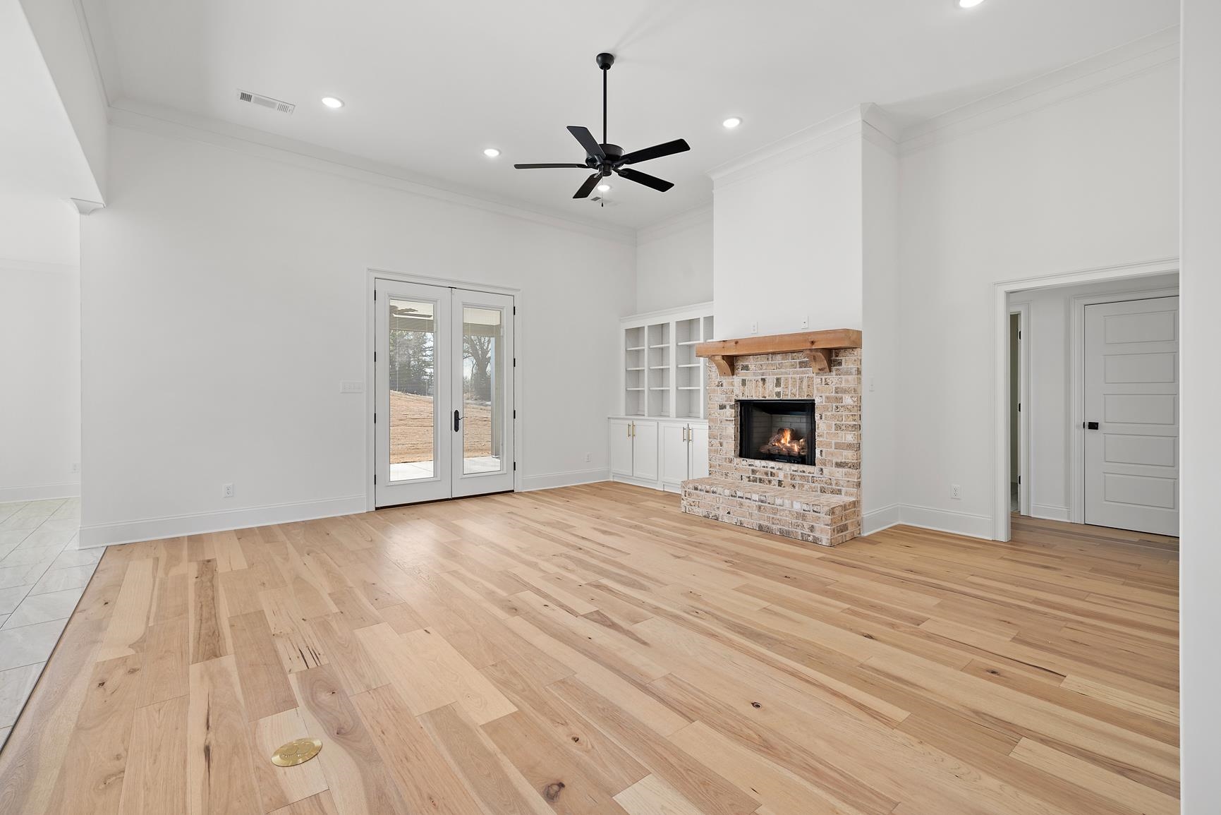 822 Leta Loop Brighton, TN 38011 - Photo 6 of 40 a view of empty room with wooden floor and fireplace