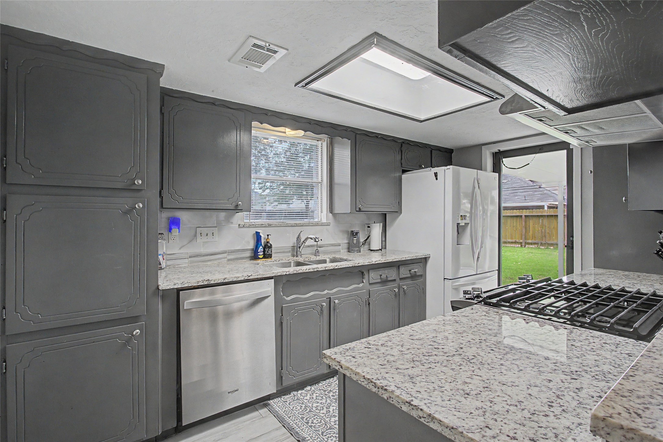 327 Fir Ridge Drive Huffman, TX 77336 - Photo 10 of 25 Granite countertops with updated stainless steel appliances
