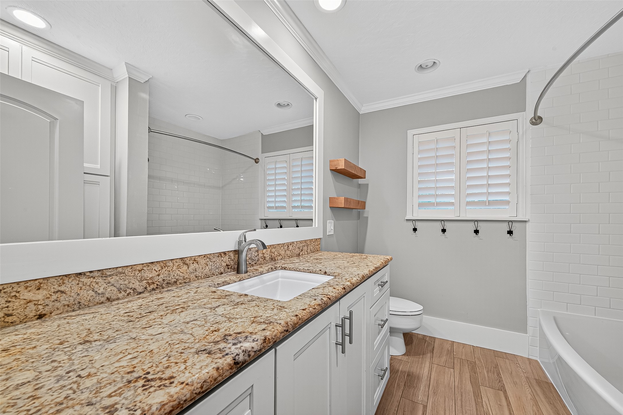 3115 Eula Morgan Road Katy, TX 77493 - Photo 31 of 36 a bathroom with a granite countertop sink a toilet and a bathtub