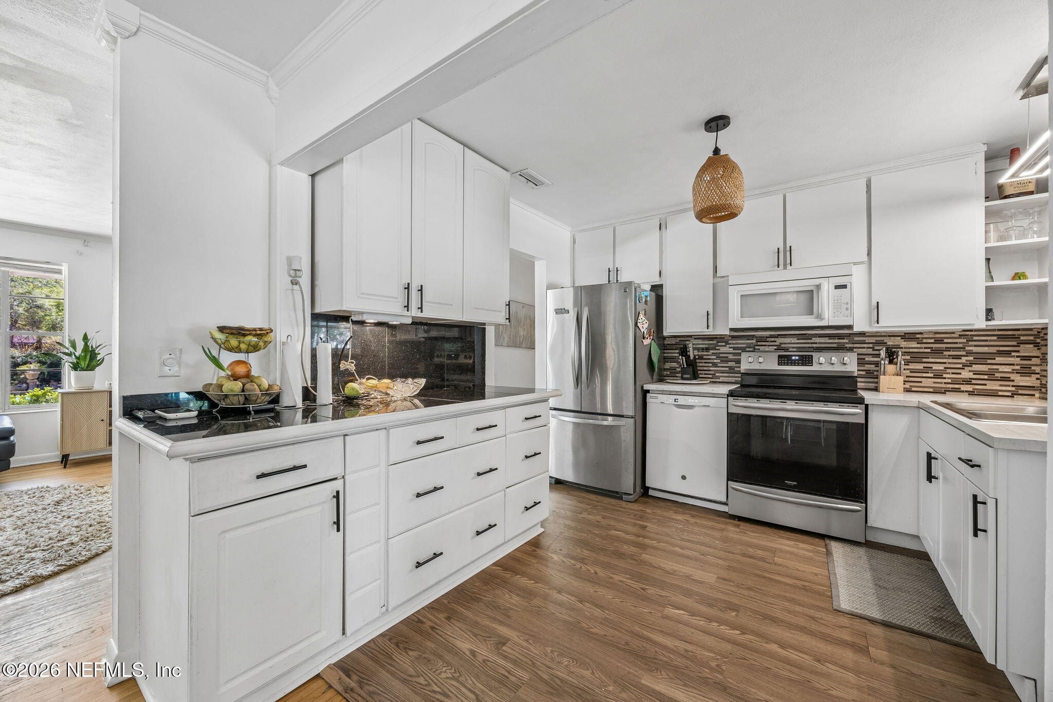 5136 Eulace Road Jacksonville, FL 32210 - Photo 12 of 41 a kitchen with granite countertop a sink cabinets and stainless steel appliances