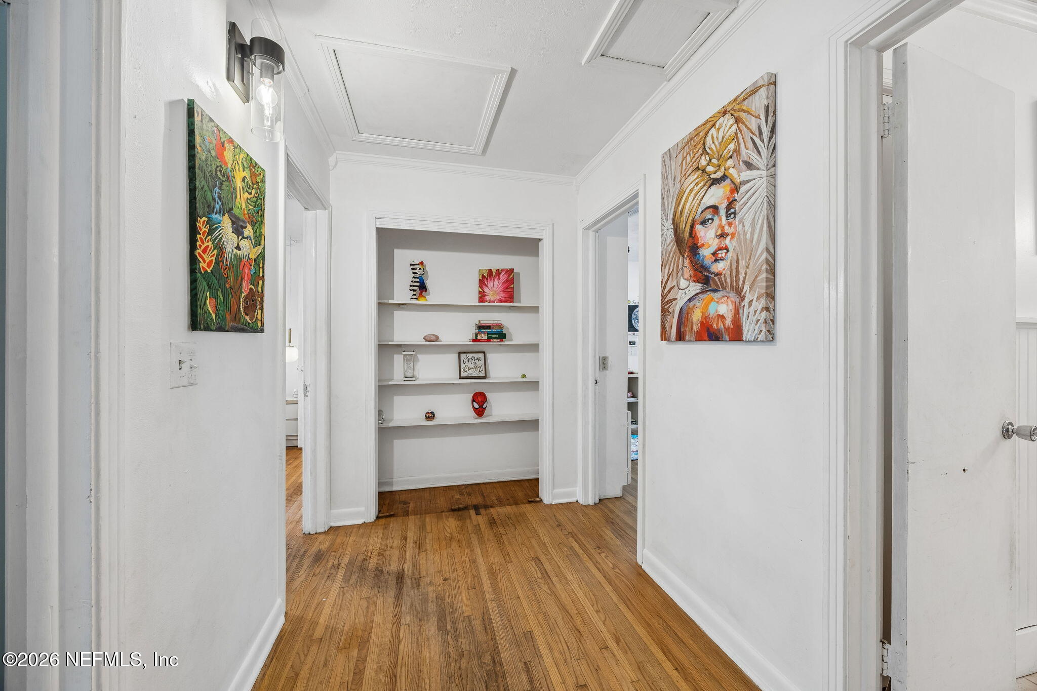 5136 Eulace Road Jacksonville, FL 32210 - Photo 15 of 41 a view of a hallway with wooden floor and closet