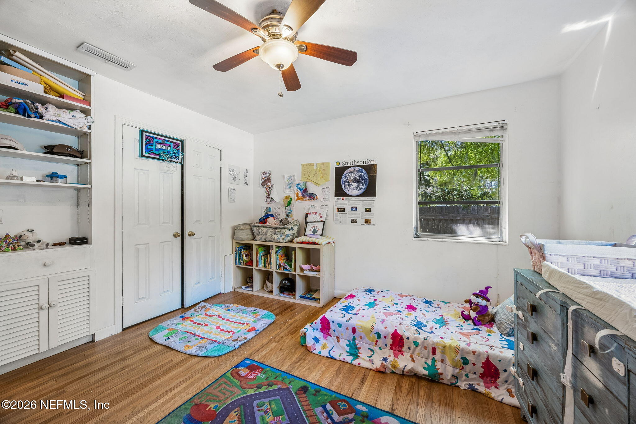 5136 Eulace Road Jacksonville, FL 32210 - Photo 23 of 41 a bedroom with a bed and a dresser in it