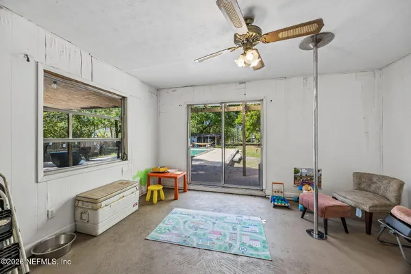 a living room with furniture and a window