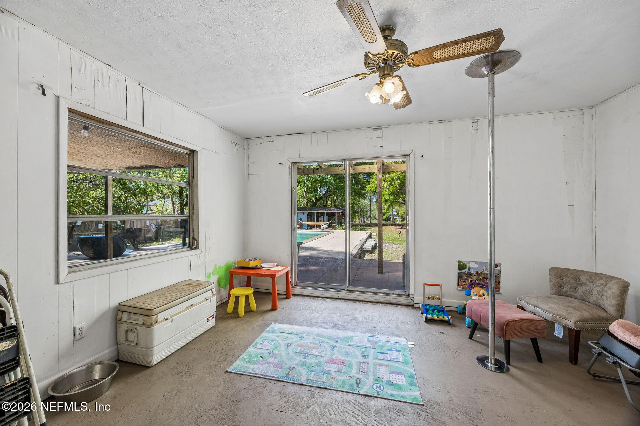 5136 Eulace Road Jacksonville, FL 32210 - Photo 25 of 41 a living room with furniture and a window