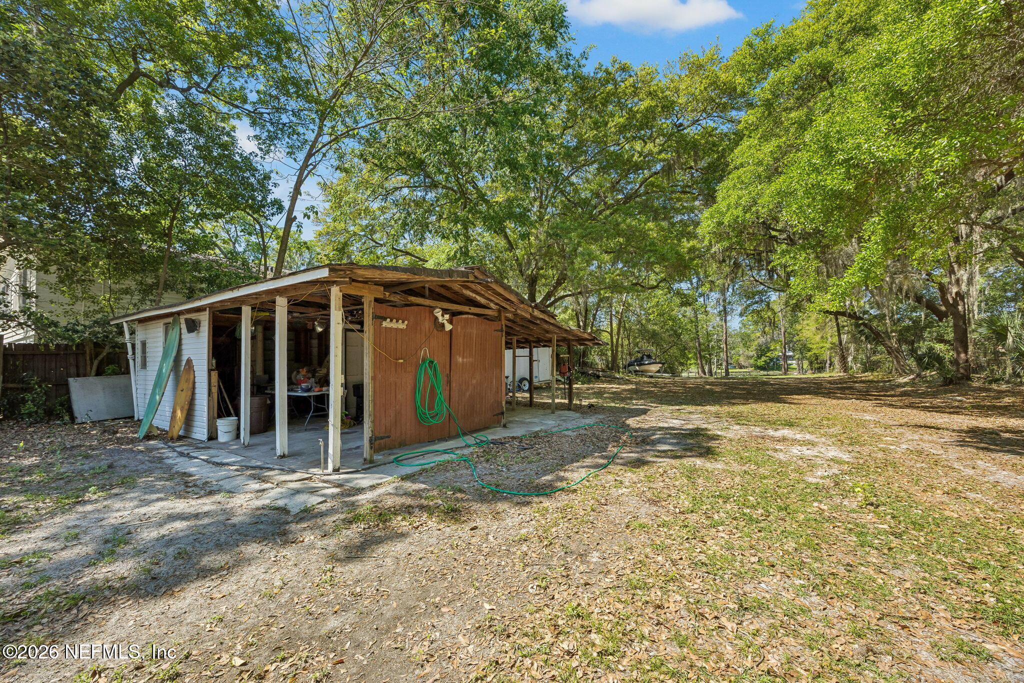 5136 Eulace Road Jacksonville, FL 32210 - Photo 29 of 41 a view of wooden house with large trees