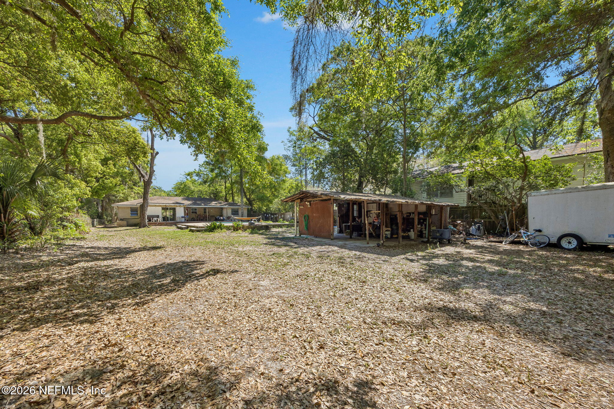 5136 Eulace Road Jacksonville, FL 32210 - Photo 30 of 41 a backyard of a house with barbeque oven