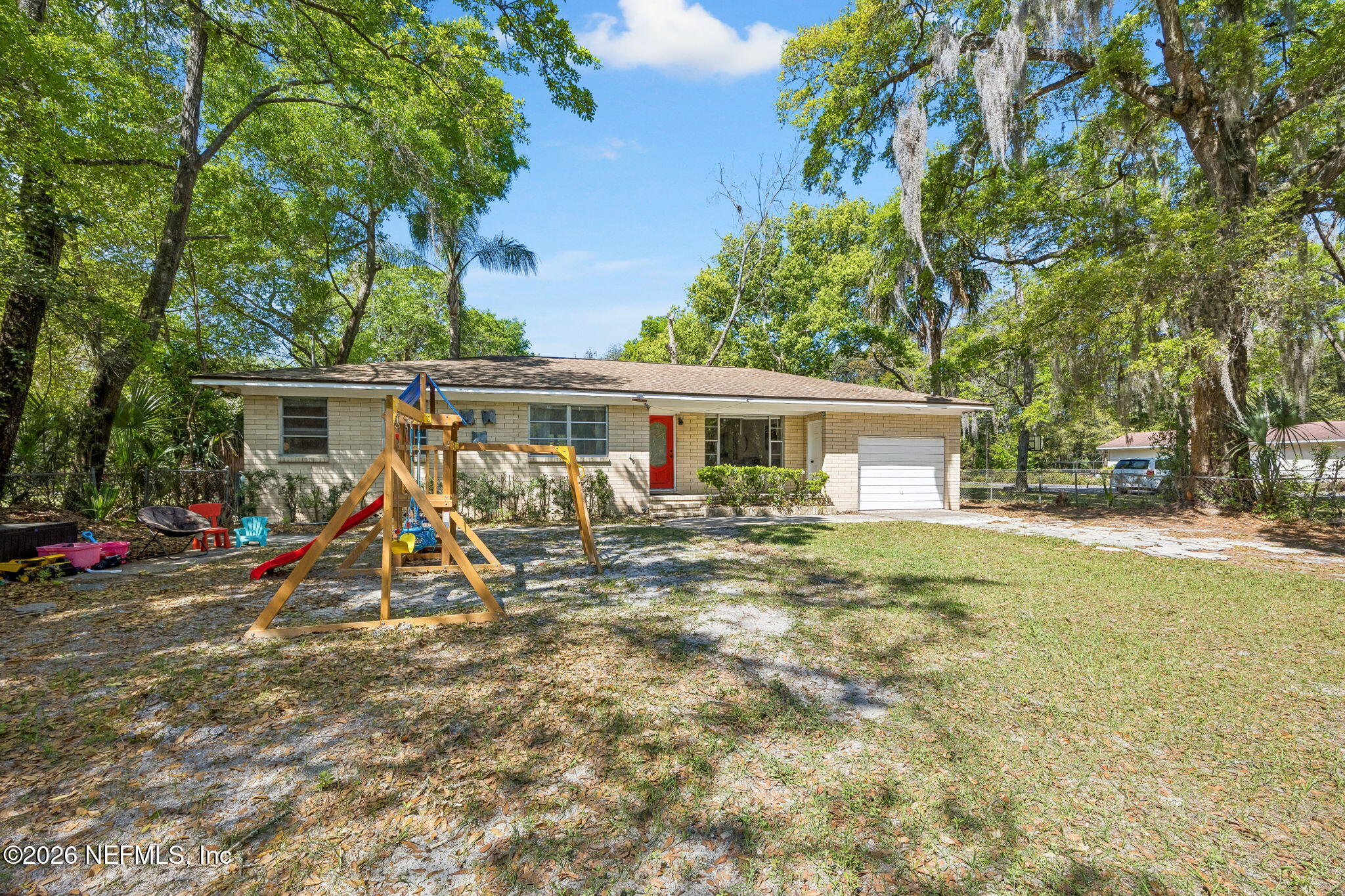 5136 Eulace Road Jacksonville, FL 32210 - Photo 5 of 41 a view of a house with a yard and sitting area