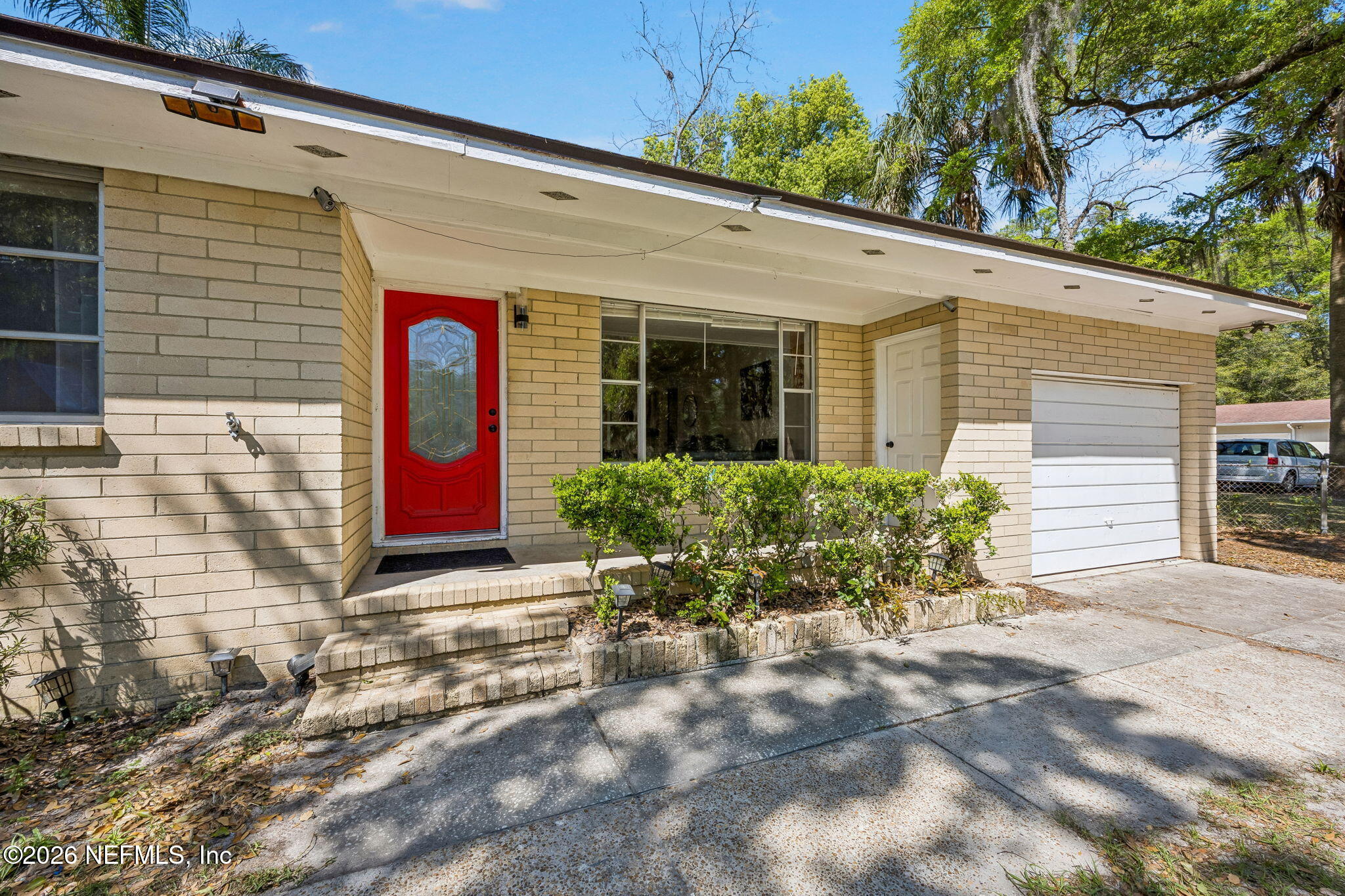 5136 Eulace Road Jacksonville, FL 32210 - Photo 6 of 41 a front view of a house with entryway