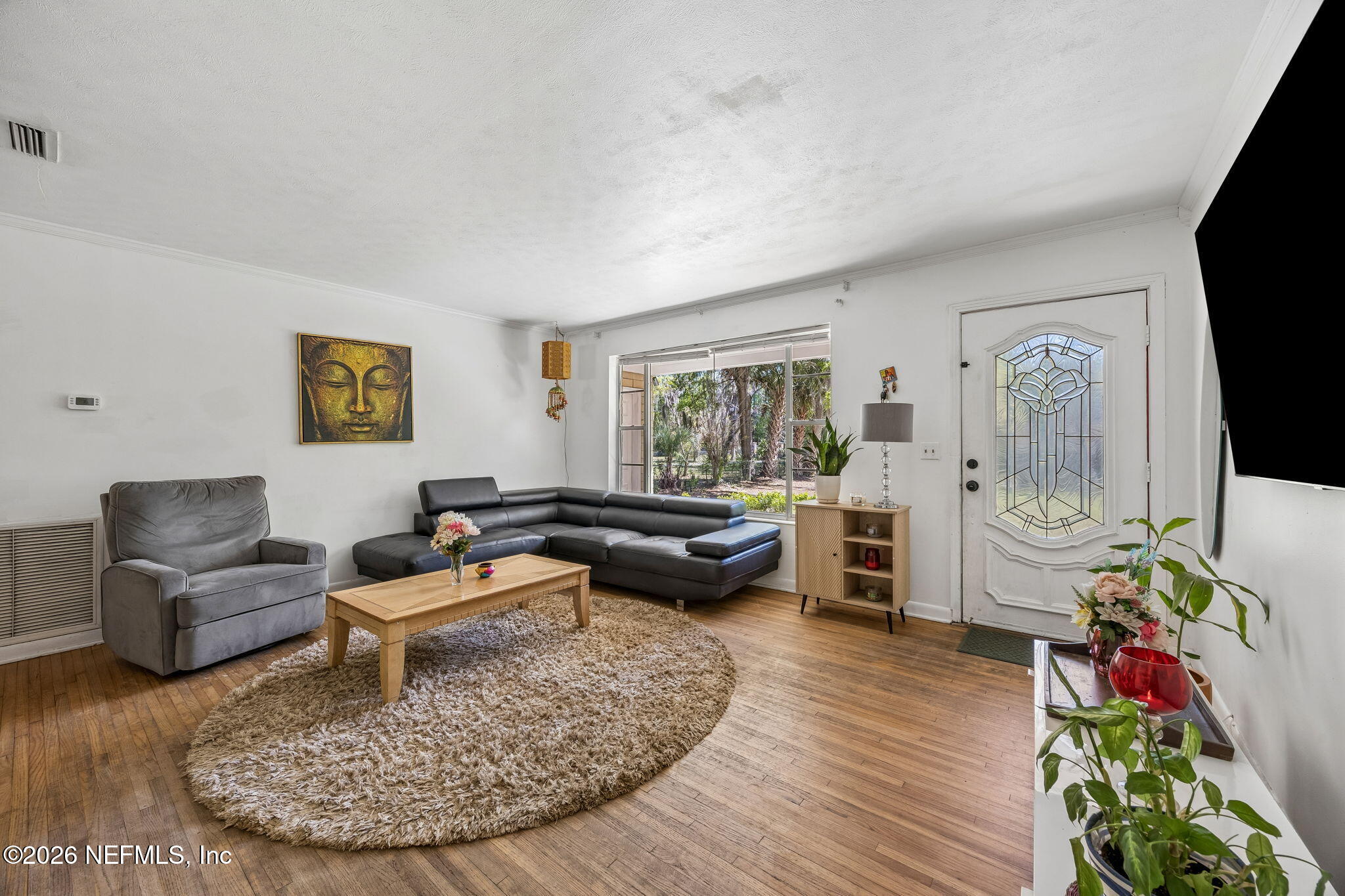 5136 Eulace Road Jacksonville, FL 32210 - Photo 9 of 41 a living room with furniture and a wooden floor