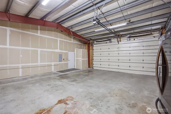 a view of empty room with wooden ceiling