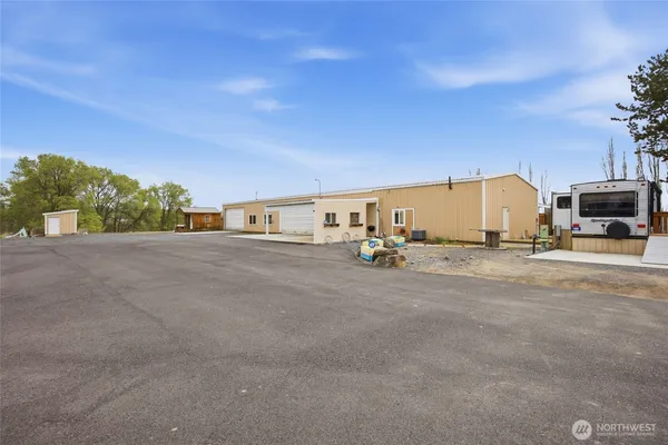 a view of a house with a backyard