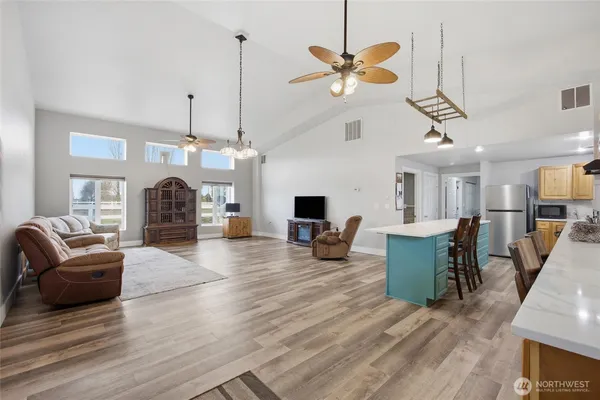 a living room with furniture and a chandelier