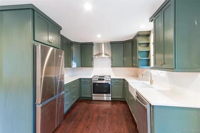 a kitchen with stainless steel appliances granite countertop a sink and stove