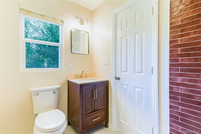 a bathroom with a sink a toilet and tub
