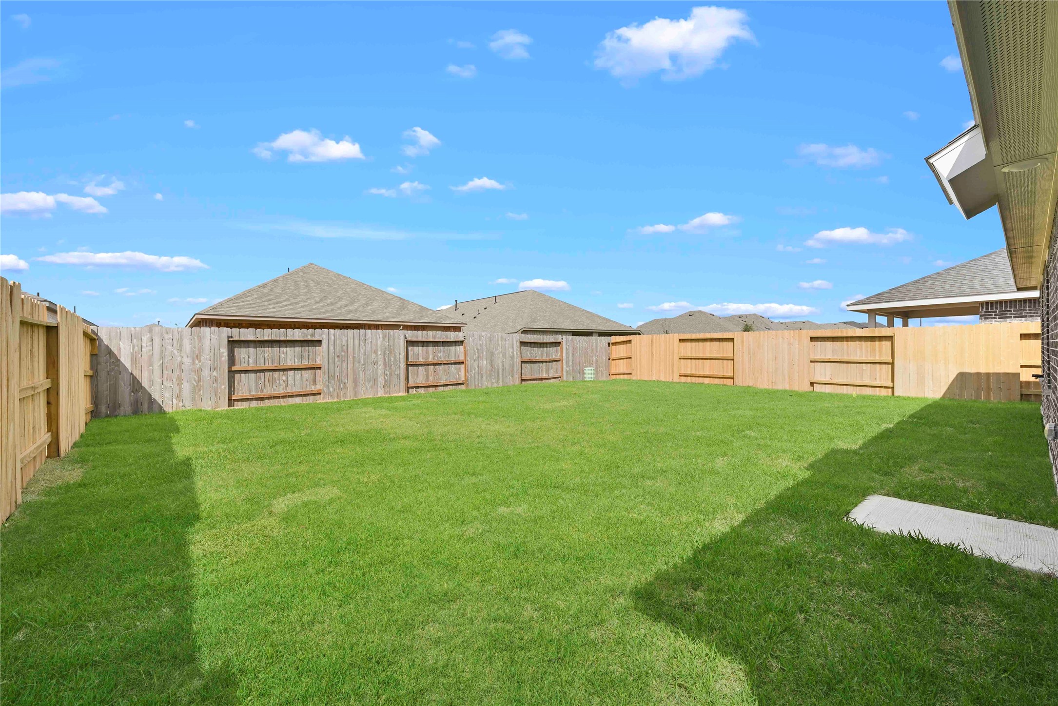 22010 Vernazza Bend Hockley, TX 77447 - Photo 16 of 36 a view of a big house with a big yard