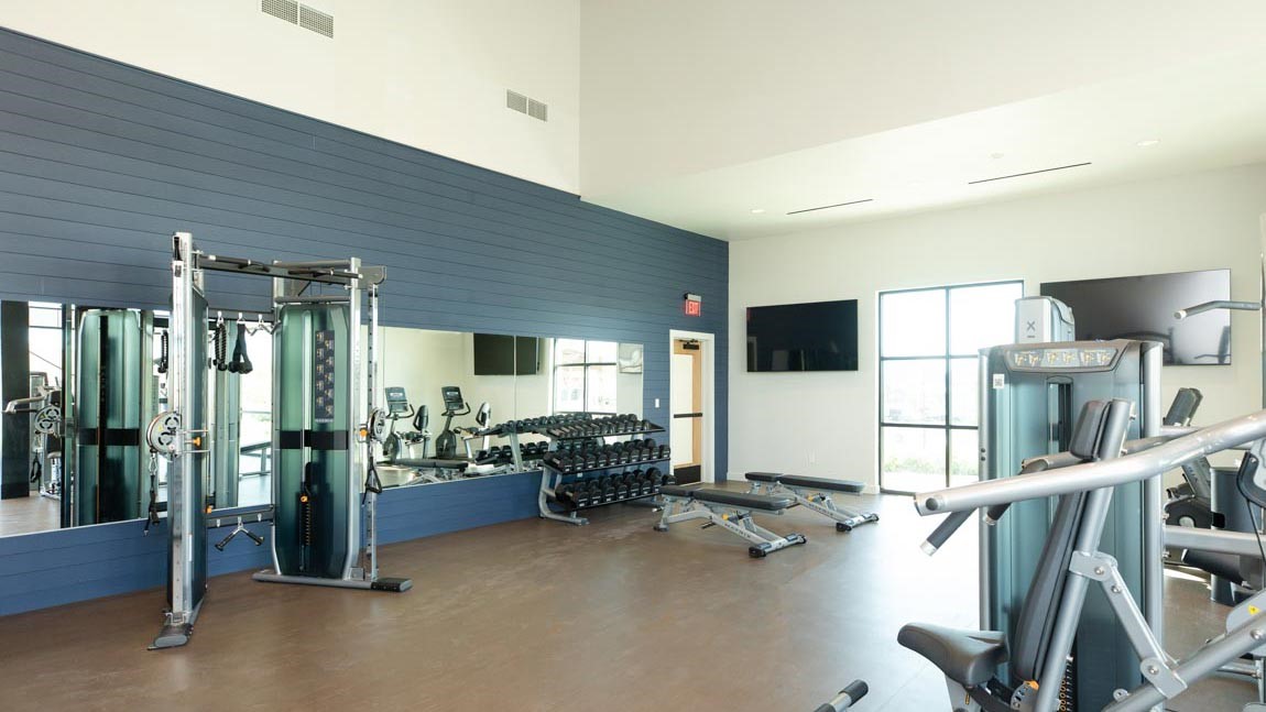 22010 Vernazza Bend Hockley, TX 77447 - Photo 27 of 36 a room with gym equipment and a large window