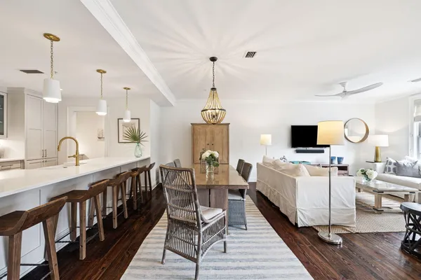 a large kitchen with a table and chairs