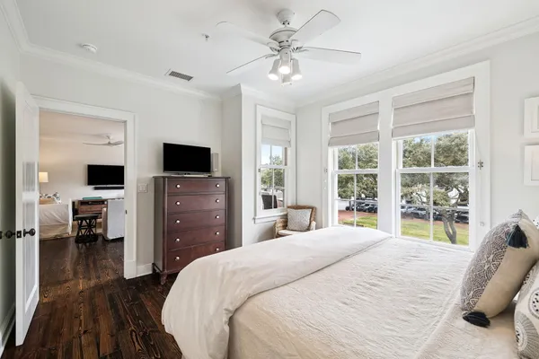 a bedroom with a bed and a television