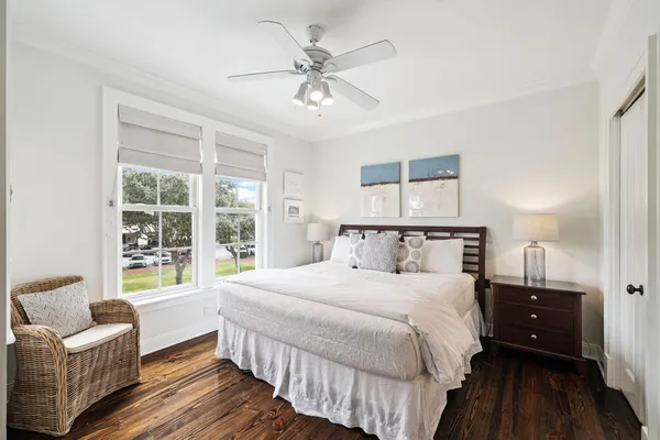 a bedroom with a large bed and a window