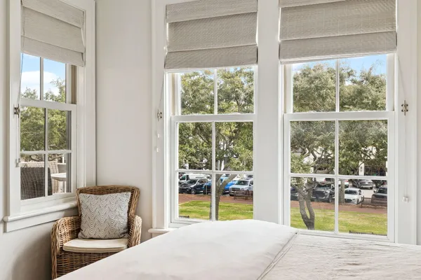 a bedroom with furniture and a window