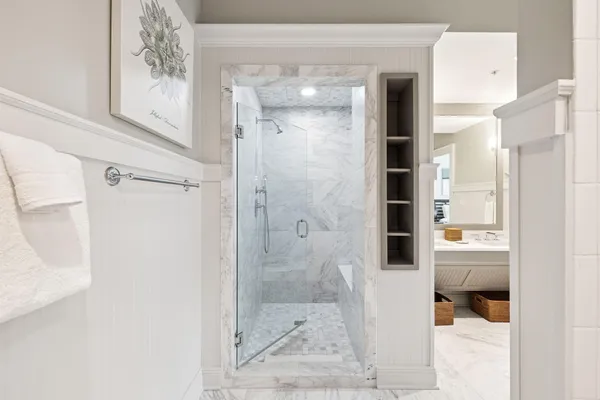 a bathroom with a glass shower door