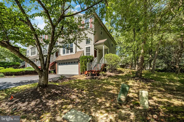 a view of a house with a tree