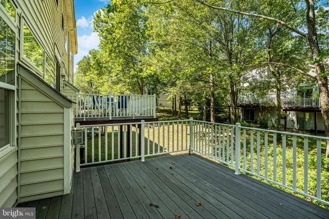 a view of a balcony with wooden floor