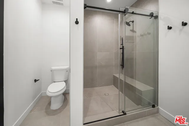 a view of a hallway with washer and dryer