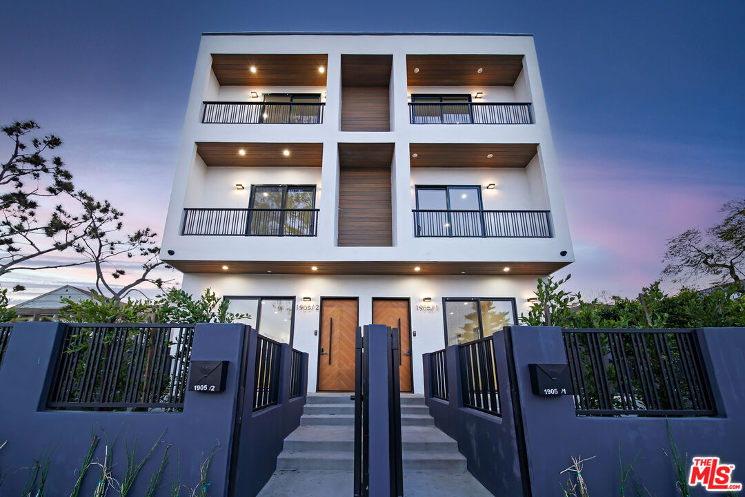 1905 South Corning Street, Unit 2 Los Angeles, CA 90034 - Photo 5 of 26 a view of a house with a yard