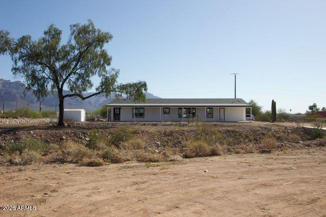 1470 South Bowman Road Apache Junction, AZ 85119 - Photo 49 of 56 a front view of a house with a yard