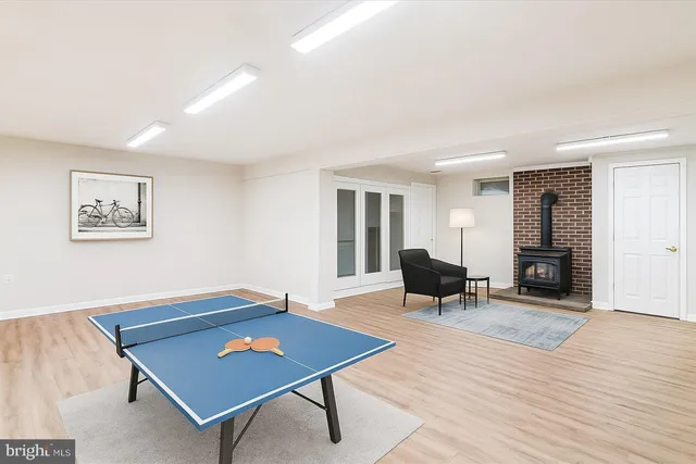 a living room with furniture a table and wooden floor