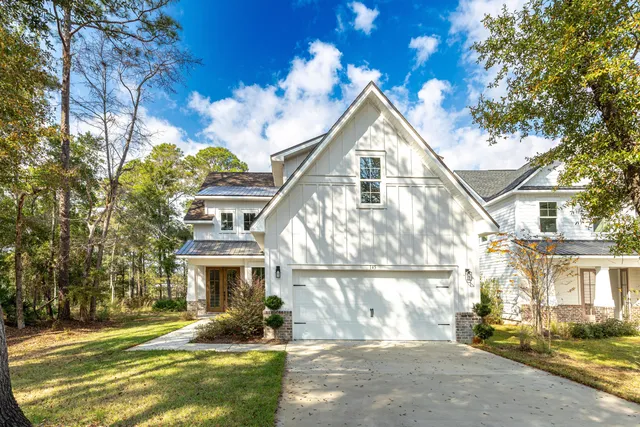 a view of a house with backyard porch and sitting area